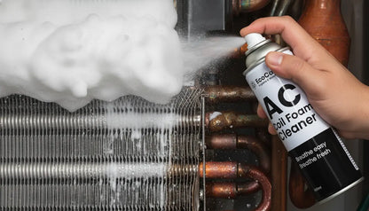Person using a can of AC coil foam cleaner on a cooling system